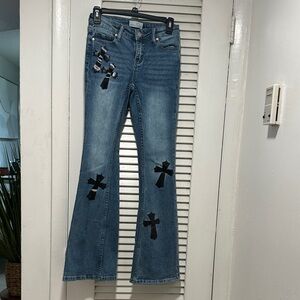 Austin landing Women’s Blue Embellished Flare Jeans with Black Cross Appliqués